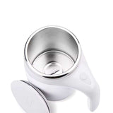 Rechargeable automatic stirring mug with stainless steel interior and white handle, designed for on-the-go mixing.