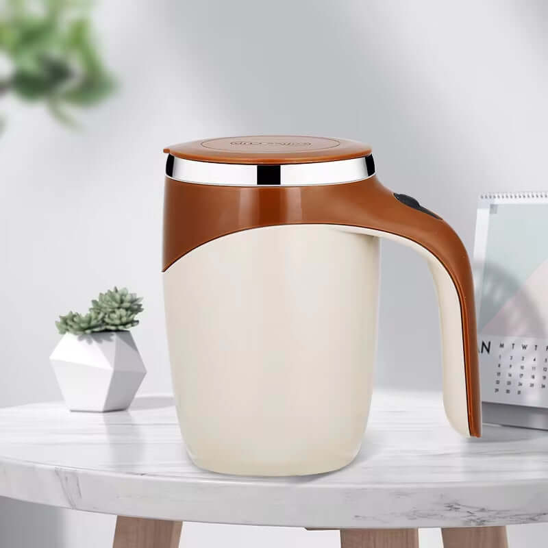 Automatic stirring mug with a sleek design, featuring a brown lid and handle on a modern table setting.